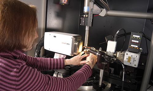 Woman adjusting diffractometer