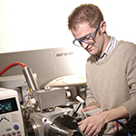 A male researcher using mass spectrometry equipment