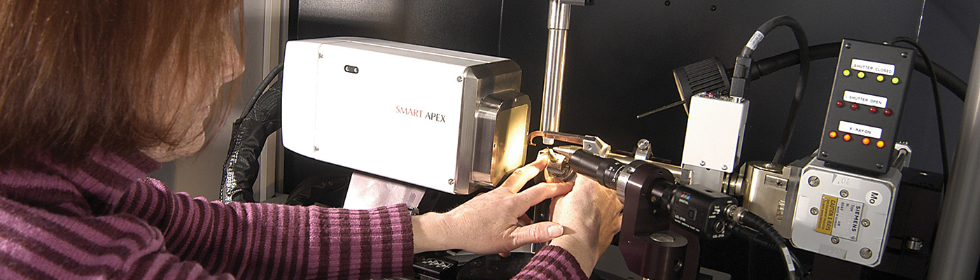 Woman adjusting diffractometer