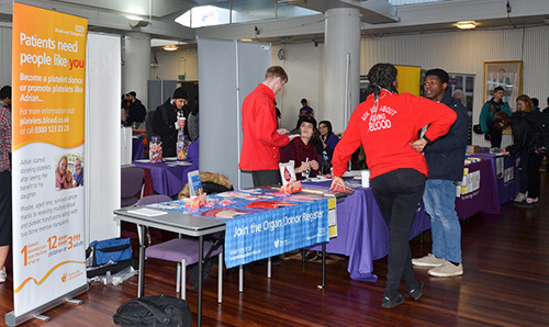 Students stood in Renold Building at Making a Difference fair