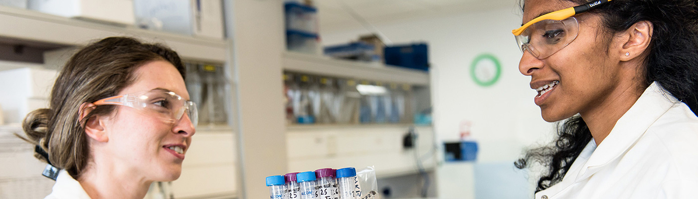 Female students talking in a lab