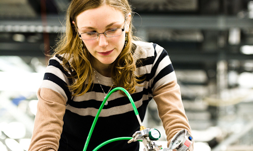 Female researcher using EPR equipment