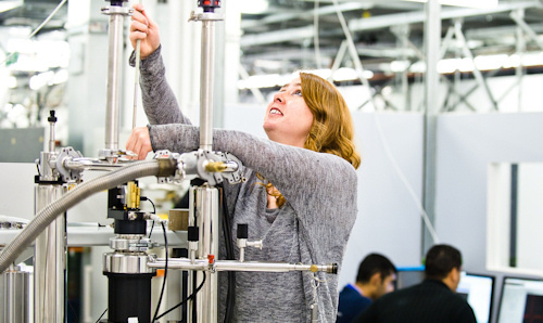 Female researcher using EPR equipment