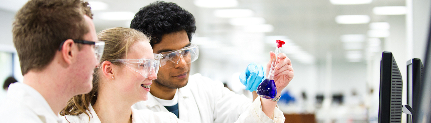 Three students in chemistry lab