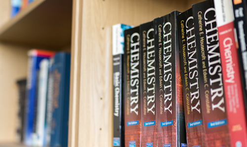 A shelf of chemistry textbooks